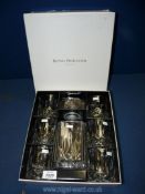 A boxed set of Royal Doulton decanter and whisky glasses.