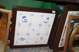 Nine blue and white Delft style tiles set in a dark wood frame, 21 3/4'' square.