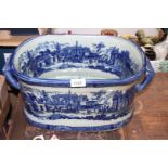 A reproduction blue and white Ironstone Footbath, 19'' long x 11 1/2'' deep x 8'' high.