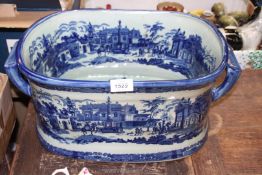 A reproduction blue and white Ironstone Footbath, 19'' long x 11 1/2'' deep x 8'' high.