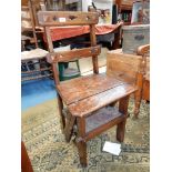 A cleverly designed Arts & Crafts oak framed Puginesque metamorphic action side chair that converts