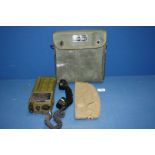 A Racal Field Telephone British Army PTC404 and a German military Bamberger Mutzen Industrie hat.