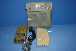 A Racal Field Telephone British Army PTC404 and a German military Bamberger Mutzen Industrie hat.