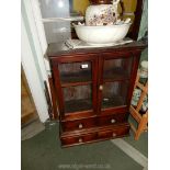 An appealing double doored glazed Cabinet having a pair of short drawers below,