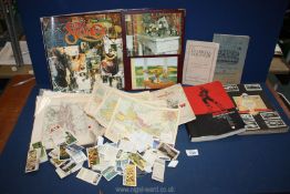 A quantity of miscellanea to include; cigarette cards, scrap book, postcards,