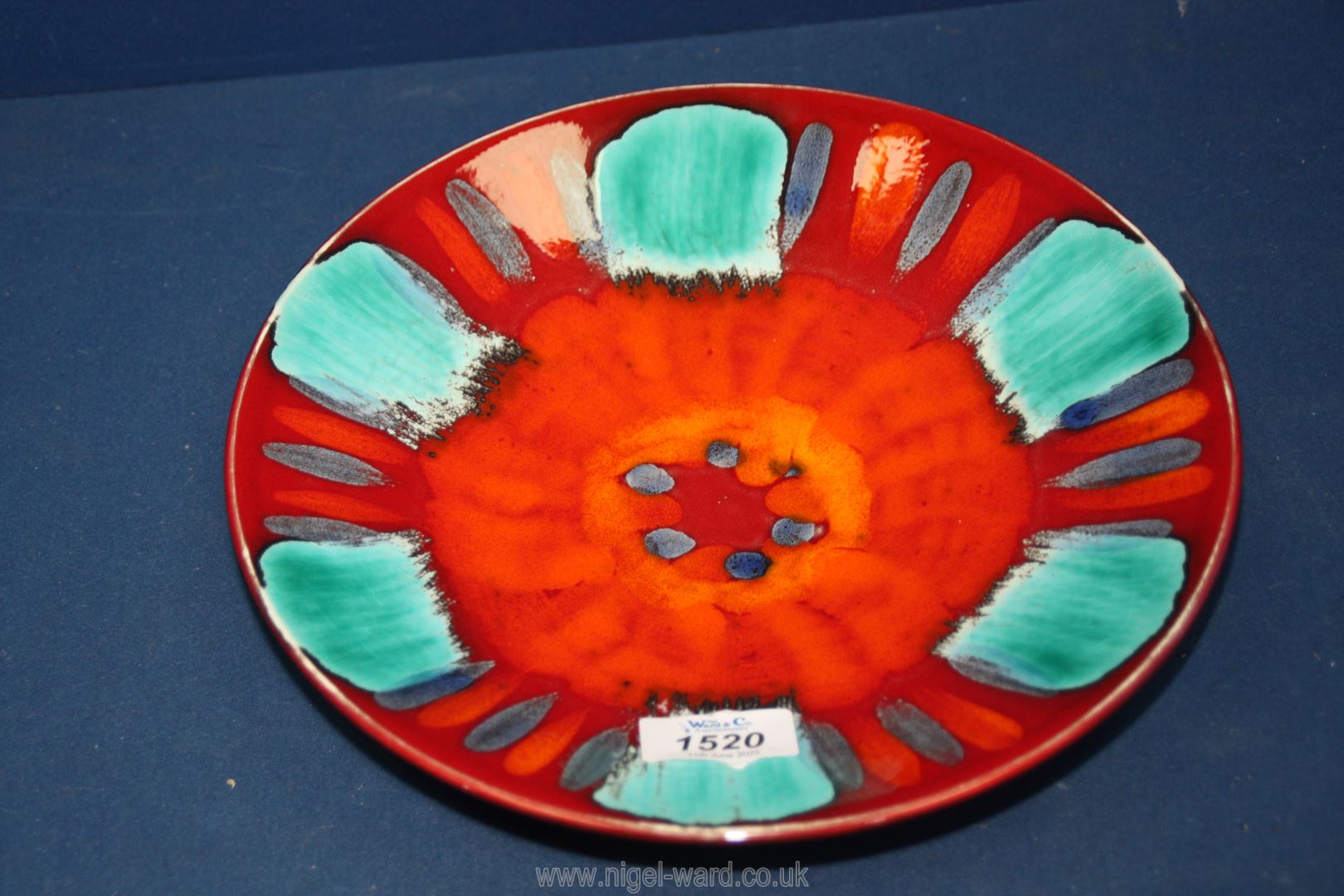 A small Poole Pottery charger in 'Volcano' pattern, 10 1/4'' diameter.