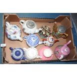 Nine assorted Teapots to include Wedgwood, blue and white, oriental etc., (some with damage).