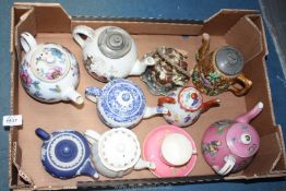 Nine assorted Teapots to include Wedgwood, blue and white, oriental etc., (some with damage).