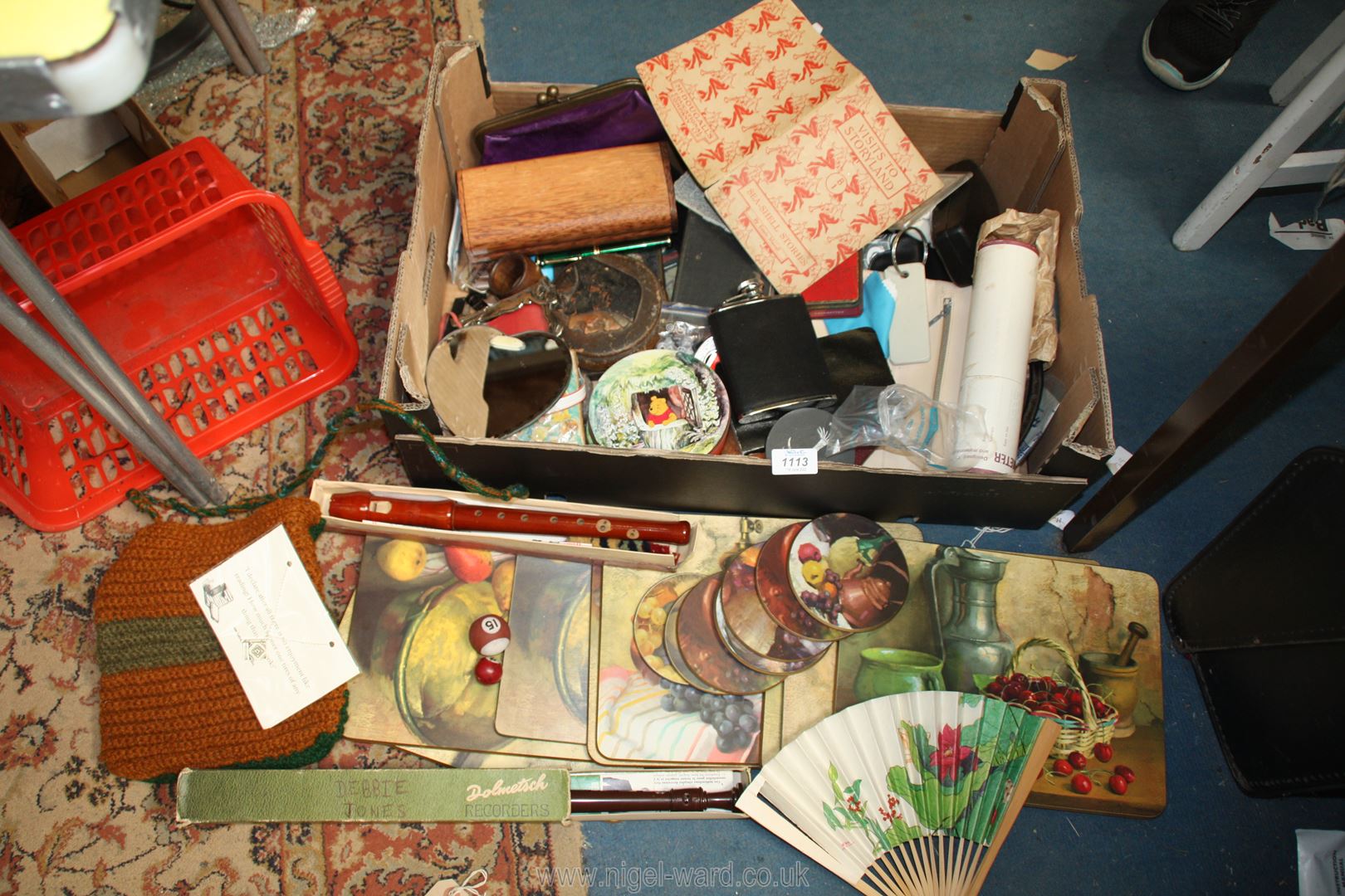 A box of miscellanea including recorders, leather wallet, wooden pencil box, small torches,