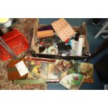 A box of miscellanea including recorders, leather wallet, wooden pencil box, small torches,