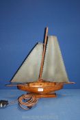 A novelty table lamp in the shape of a sailing boat with the sails forming the shades 21 1/2" long