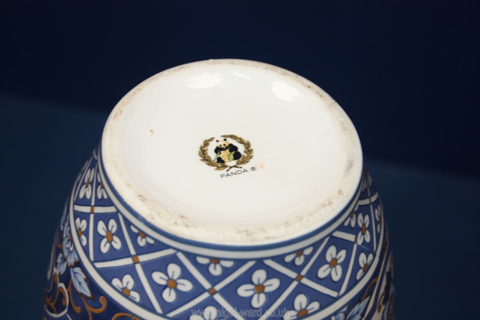 An oriental style Vase with panels of blue and gold Peacocks between floral detail on a white - Image 2 of 2