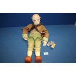 An unusual puppet of an old gent with composite head and hands and wooden body and legs,