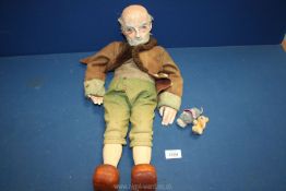 An unusual puppet of an old gent with composite head and hands and wooden body and legs,