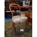 A circa 1900 Walnut framed balloon back side Chair having canted cabriole legs overstuffed