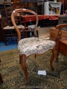 A circa 1900 Walnut framed balloon back side Chair having canted cabriole legs overstuffed
