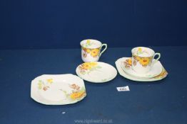 Two Shelley Trios in yellow rambling rose pattern.