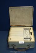 A Ferranti transistor portable radio from the 1950's in a cream carrying case.