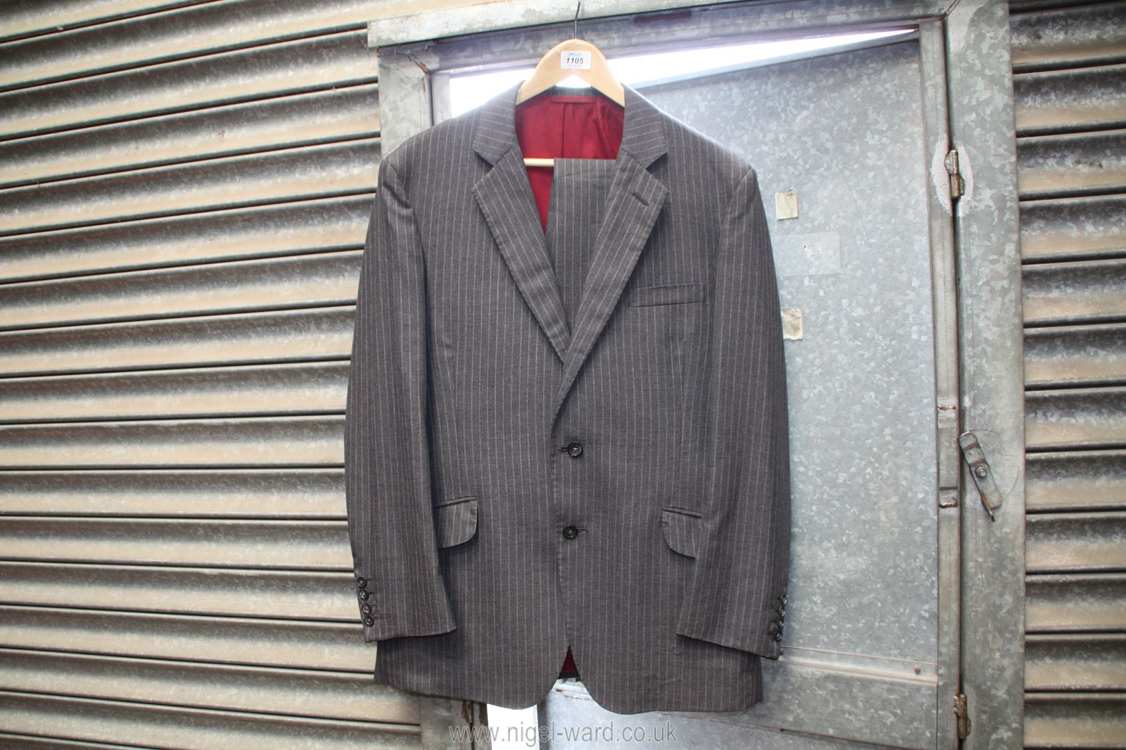 An all wool pin stripe suit, 38'' chest, 32'' waist.