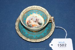 A Royal Vienna cabinet cup and saucer with delicate gilt detailing on cream and turquoise ground,
