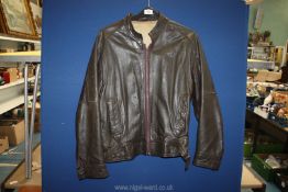 A dark brown Harrod's leather bomber jacket, size 38'', some minor wear.