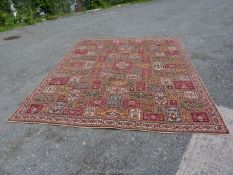 A bordered and patterned Wilton style Carpet,