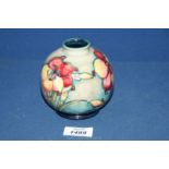 A small Moorcroft vase in 'African Lily' pattern,