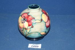 A small Moorcroft vase in 'African Lily' pattern,