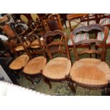 A set of four unusual seagrass seated Dining Chairs having ladder backs and carved top rail