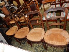 A set of four unusual seagrass seated Dining Chairs having ladder backs and carved top rail