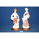 A pair of figures of a lady and gentleman, signed A. Balconi, some damage to flowers, 11 1/4'' tall.