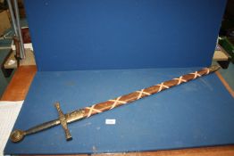 A reproduction 'Excalibar' sword with dragons to hilt, with sheath, 44'' overall.