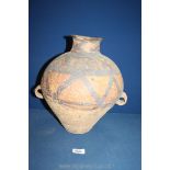 A Chinese Neolithic double handled Jar decorated in black with zig zags and stylised leaves,