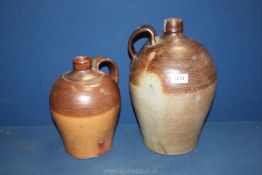 Two 19th c. cider/water stoneware flagons, some chips, 10" tall and 13 1/2" tall.