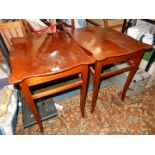 A pair of Mahogany occasional Tables having serpentine edged tops and standing tapering square