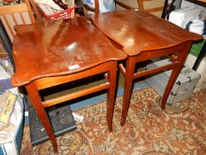 A pair of Mahogany occasional Tables having serpentine edged tops and standing tapering square