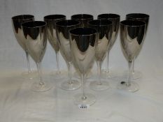 Ten glass silver lustre wine glasses.