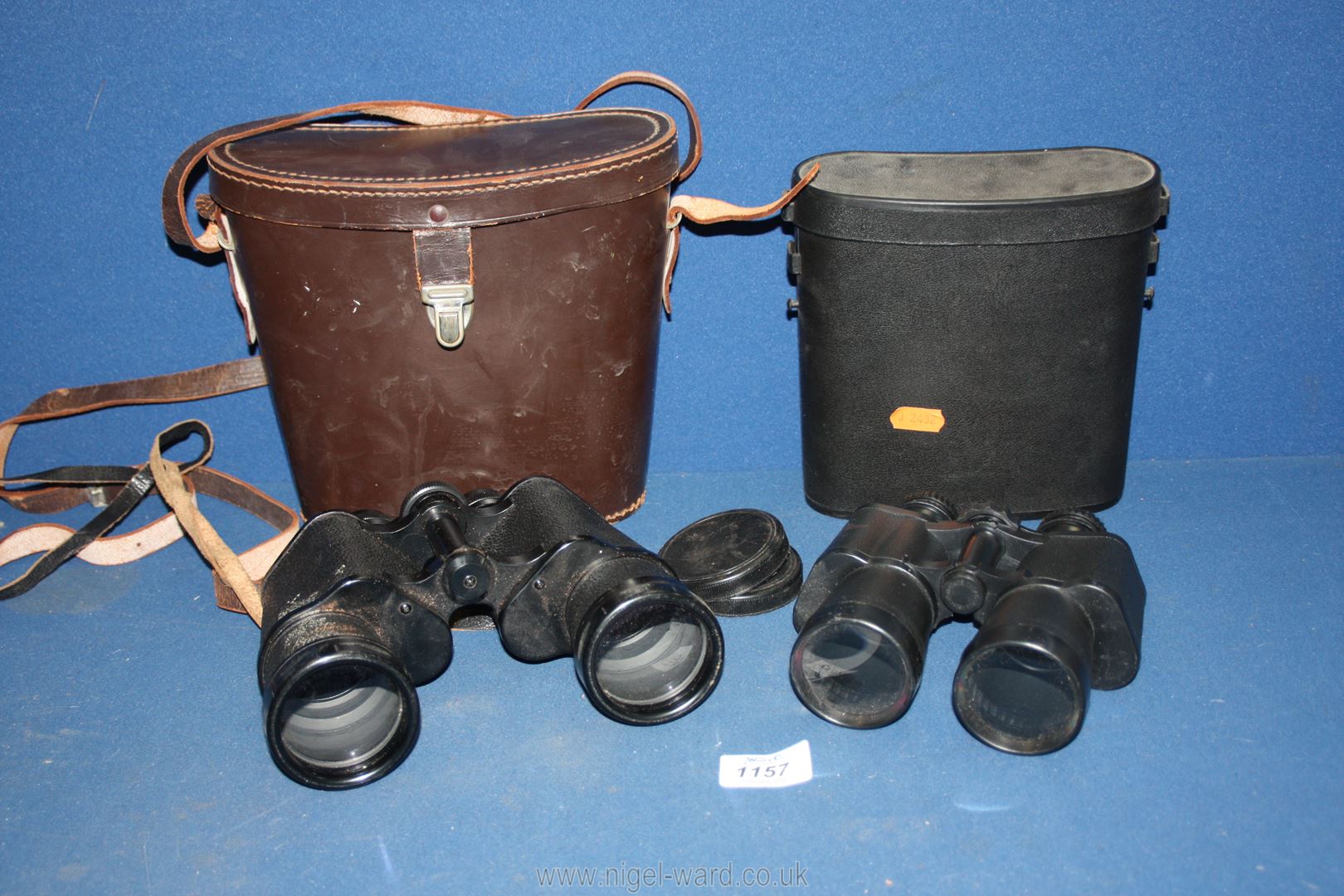 Two pairs of binoculars, one pair 10 x 50 by Charles Frank, the other plastic.