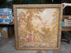 A large machine made framed Tapestry depicting two girls fishing in a stream,