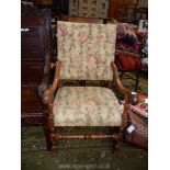 An elegant open armed Armchair having attractive scroll terminating arms,