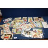 A box containing 50 saucy/comic postcards mainly Bamforth from 1950's/60's/70's.