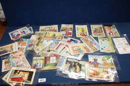 A box containing 50 saucy/comic postcards mainly Bamforth from 1950's/60's/70's.