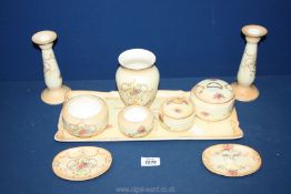 A Crown Ducal blush dressing Table set including tray, candlestick, vase, ring dish, pots etc.