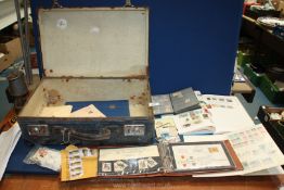 A Globetrotter suitcase and stamp collection including a stamp album and stock books and English