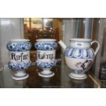 A pair of wide rimmed blue and white ceramic Apothecary jars, some chips to base,