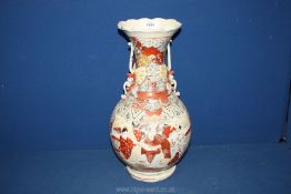 A large oriental Vase with two handles having applied butterfly detail with figures on the main