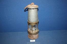 A Sheffield Davy Lamp by Wolf Safety, 11 1/4'' tall.