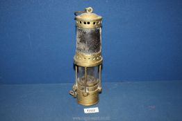 A brass and metal Davy Lamp, 10 1/2'' tall.