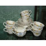 A Spode 'Buttercup' part tea service, six each cups, saucers, tea plates and milk jug.