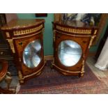 A pair of most ornate Corner Cabinets each having an upper frieze drawer and an oval panel glazed